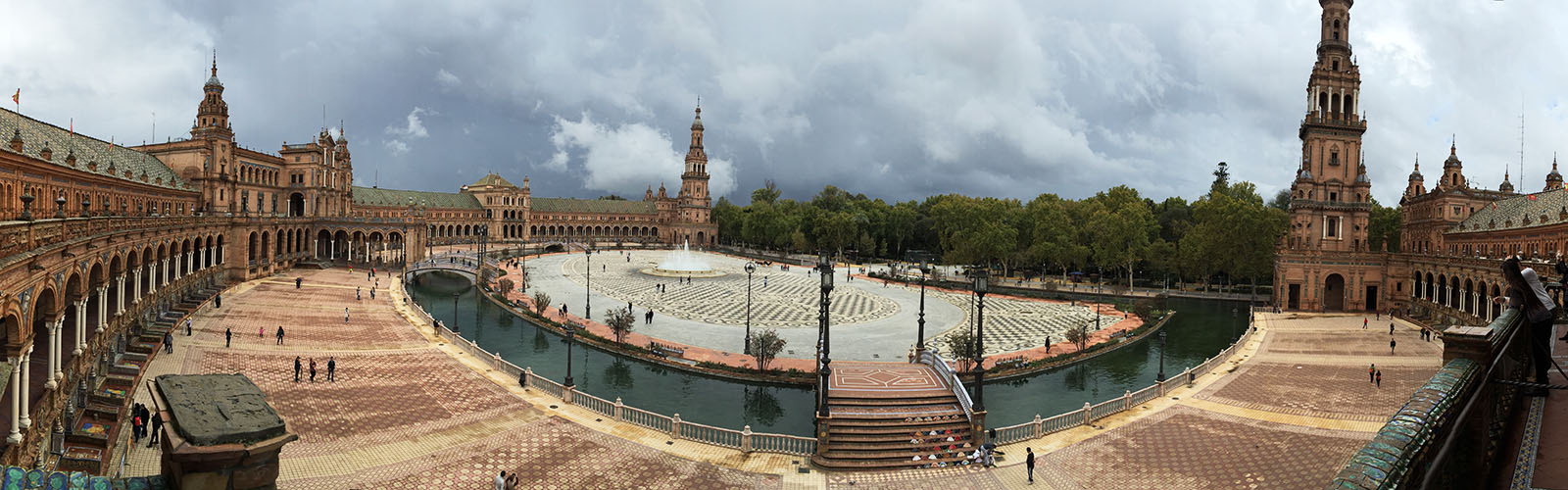 An elevated view of Seville's building-wrapped, semi-circular Plaza de España.